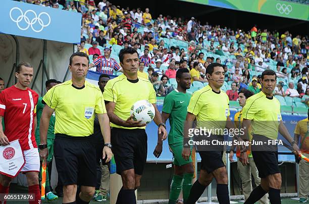 Referee Sandro Ricci and assistant referees work out during the Men's Football Quarter Final match between Nigeria and Denmark on Day 8 of the Rio...