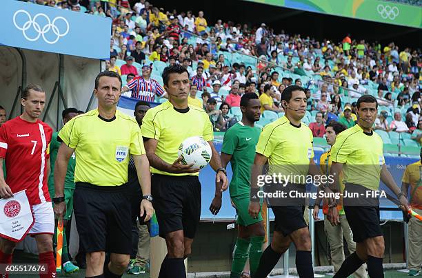 Referee Sandro Ricci and assistant referees work out during the Men's Football Quarter Final match between Nigeria and Denmark on Day 8 of the Rio...