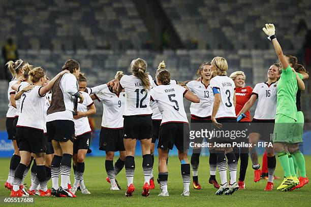 The team of Germany celebrates after winning the Women's Semi Final match between Canada and Germany on Day 11 of the Rio2016 Olympic Games at...