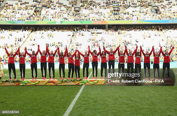 Canada celebrate after they defeated Brazil during the Women's Football Bronze Medal match between Brazil and Canada on Day 14 of the Rio 2016...