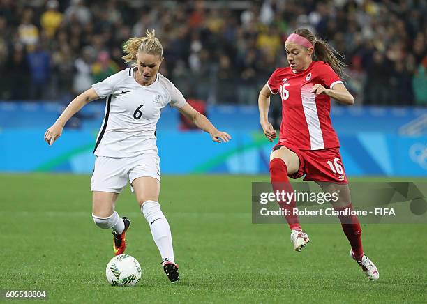 Amandine Henry of France is chased by Janine Beckie of Canada during the Women's Football Quarter Final match between Canada and France on Day 7 of...