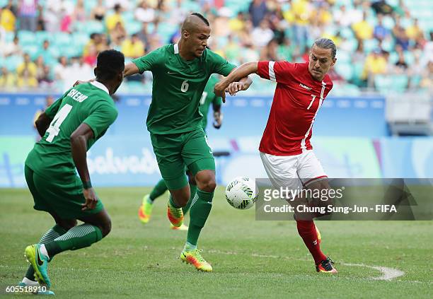 Lasse Vibe of Denmark competes for the ball with William Ekong of Nigeria during the Men's Football Quarter Final match between Nigeria and Denmark...