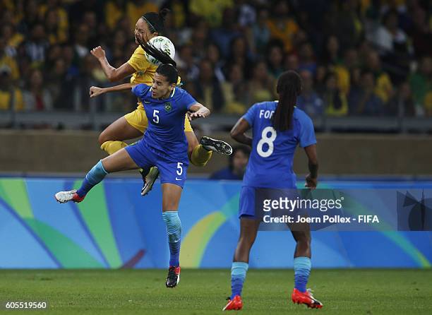 Thaisa of Brasil and Kyah Simon of Australia compete for the ball during the Women's Quarter Final match between Brasil and Australia on Day 7 of the...