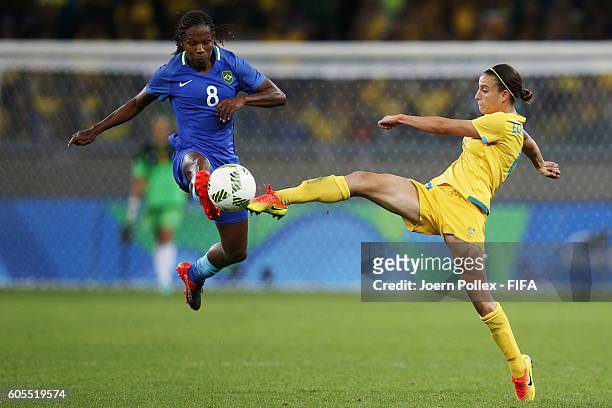 Formiga of Brasil and Katrina Gorry of Australia compete for the ball during the Women's Quarter Final match between Brasil and Australia on Day 7 of...