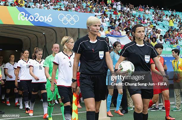 Referee Kateryna Monzul and assistant Referee Natalia Rachynska work out during the Women's Football Quarter Final match between China and Germany on...