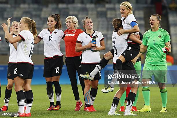 The team of Germany celebrates after winning the Women's Semi Final match between Canada and Germany on Day 11 of the Rio2016 Olympic Games at...