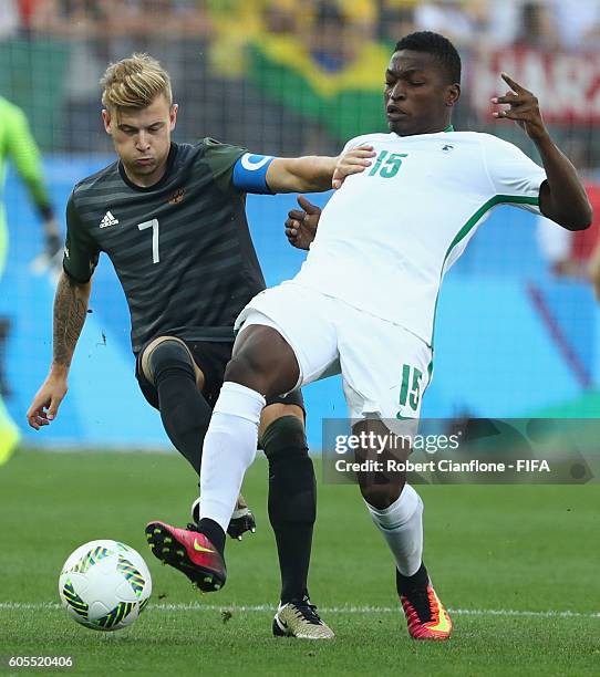 Ndifreke Udo of Nigeria is challenged by Maximilian Meyer of Germany during the Men's Football Semi Final between Nigeria and Germany on Day 12 of...