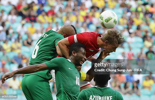Andreas Maxso of Denmark competes for the ball with Obi John Mikel of Nigeria during the Men's Football Quarter Final match between Nigeria and...