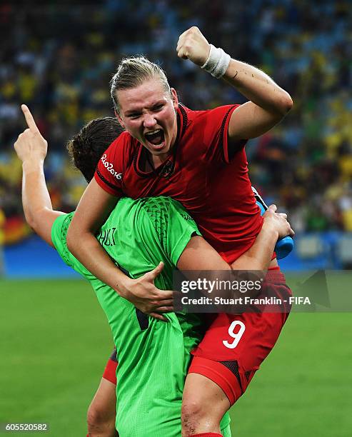 Alexandra Popp celebrates with Almuth Schult of Germany after winning the Olympic Women's Football final between Sweden and Germany at Maracana...