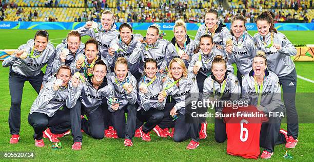 The players of Germany celebrate winning the Olympic Women's Football final between Sweden and Germany at Maracana Stadium on August 19, 2016 in Rio...