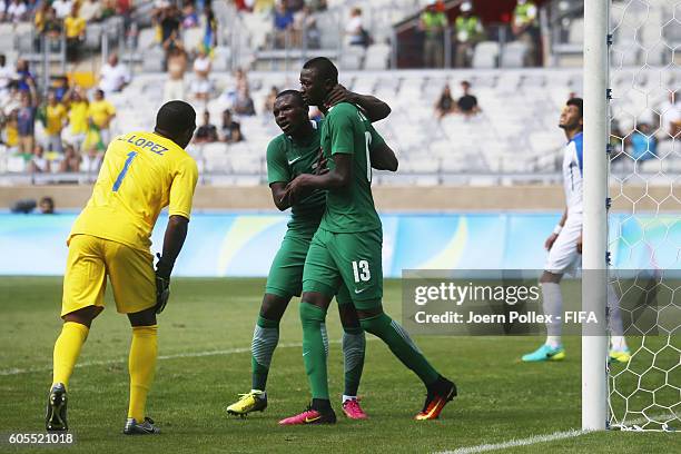 Sadiq Umar of Nigeria celebrates with his team mate Aminu Umar after scoring his team's first goal during the Men's Olympic Football Bronze Medal...