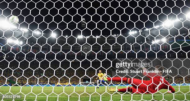 Neymar of Brazil scores the winning penalty at the Olympic Men's Final Football match between Brazil and Germany at Maracana Stadium on August 20,...