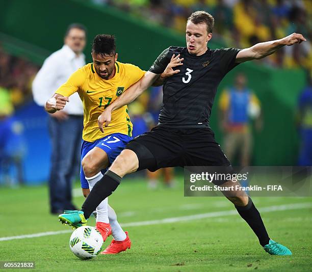 Felipe Anderson of Brazil is challenged by Lukas Klostermann of Germany during the Olympic Men's Final Football match between Brazil and Germany at...