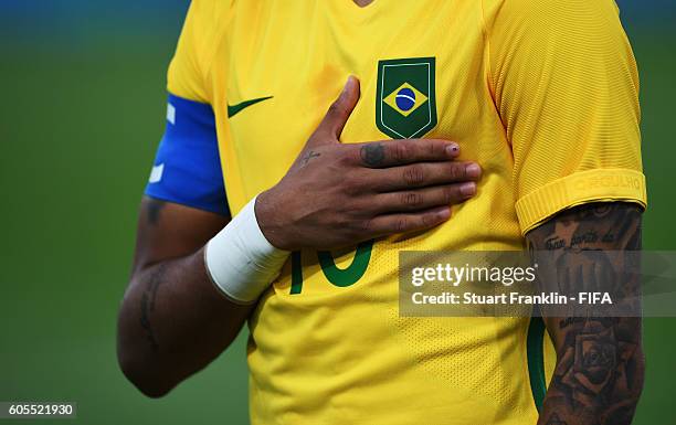 Neymar of Brazil during the national anthem during the Olympic Men's Final Football match between Brazil and Germany at Maracana Stadium on August...