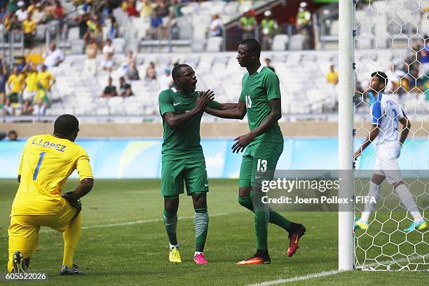 Sadiq Umar of Nigeria celebrates with his team mate Aminu Umar after scoring his team's first goal during the Men's Olympic Football Bronze Medal...