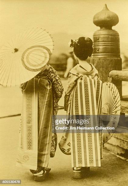 Japanese woman wearing kimono, traditional Japanese clothing and carrying parasol.