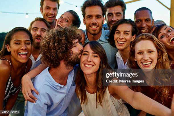 happy woman taking selfie with friends - group selfie stock-fotos und bilder