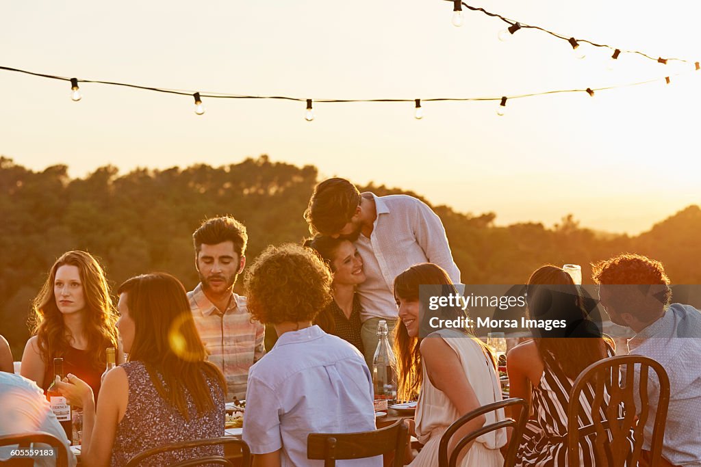 Friends enjoying at dinner party