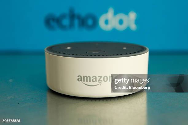 The Amazon "Echo Dot" device sits during the U.K. Launch event for the Amazon.com Inc. Echo voice-controlled home assistant speaker in London, U.K.,...