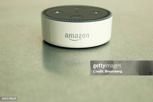 The Amazon "Echo Dot" device sits during the U.K. Launch event for the Amazon.com Inc. Echo voice-controlled home assistant speaker in London, U.K.,...