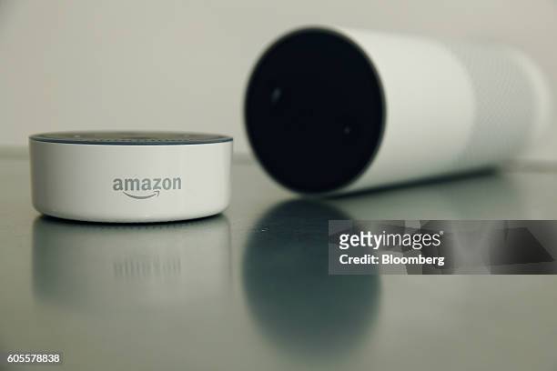 An "Echo Dot" device, left, and an "Echo" device stand on display during the U.K. Launch event for the Amazon.com Inc. Echo voice-controlled home...