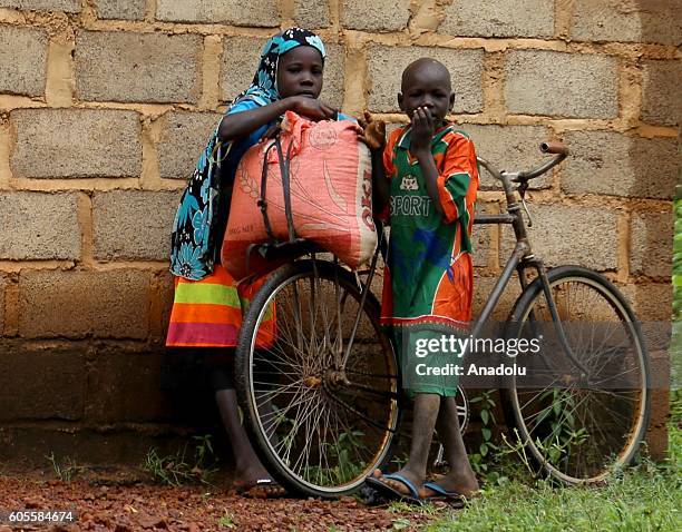 Villagers are seen as they face hardships such as hunger and thirst due to damaged crops and lack of drinking water in Lorum some 180 km east of...