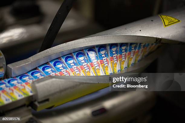 Packets of Orbit citrus fruit chewing gum travel along the production line inside the Wrigley's plant, operated by Mars Inc., in St. Petersburg,...