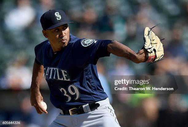 Edwin Diaz of the Seattle Mariners pitches agains the Oakland Athletics in the bottom of the ninth inning at Oakland-Alameda County Coliseum on...