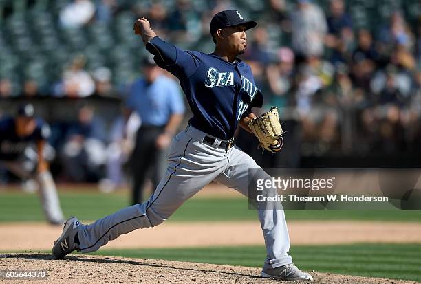 Edwin Diaz of the Seattle Mariners pitches agains the Oakland Athletics in the bottom of the ninth inning at Oakland-Alameda County Coliseum on...