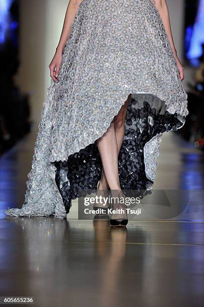 Model walks the runway with a dress by Gayeon Lee for Swarovski during the Swarovski show during the Front Row at Shoppes at Parisian on September...