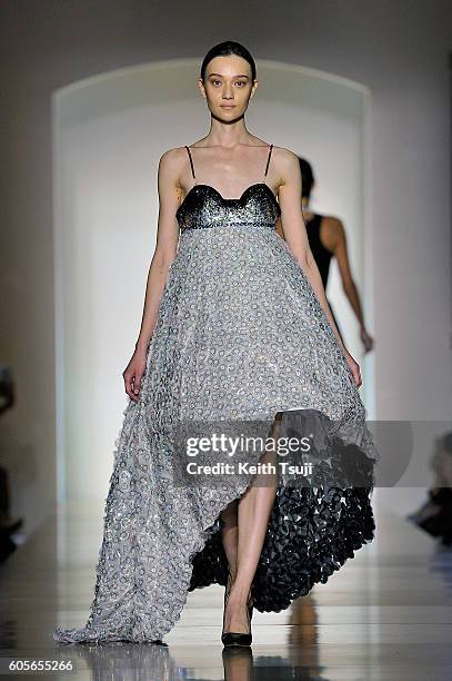 Model walks the runway with a dress by Gayeon Lee for Swarovski during the Swarovski show during the Front Row at Shoppes at Parisian on September...