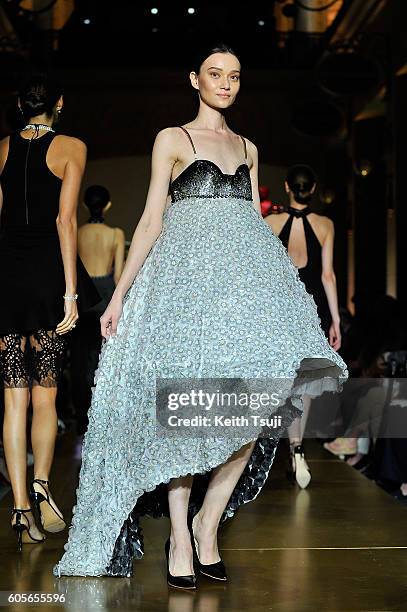 Model walks the runway with a dress by Gayeon Lee for Swarovski during the Swarovski show during the Front Row at Shoppes at Parisian on September...