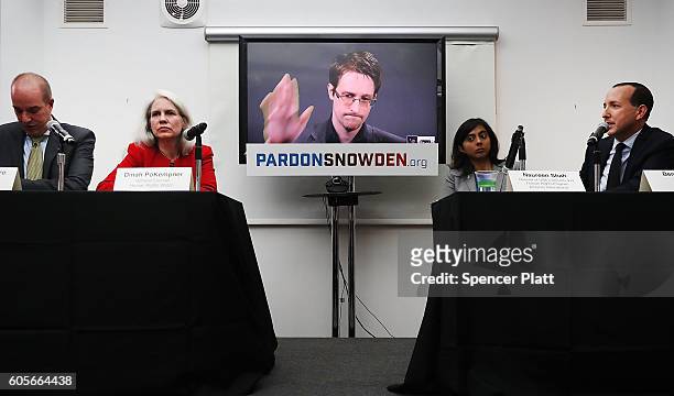 Edward Snowden speaks via video link at a news conference for the launch of a campaign calling for President Obama to pardon him on September 14,...