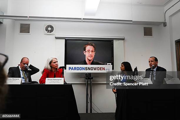 Edward Snowden speaks via video link at a news conference for the launch of a campaign calling for President Obama to pardon him on September 14,...