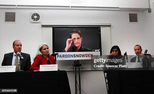 Edward Snowden speaks via video link at a news conference for the launch of a campaign calling for President Obama to pardon him on September 14,...