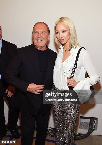 Designer Michael Kors and a guest backstage at the Michael Kors Spring 2017 Runway Show during New York Fashion Week at Spring Studios on September...