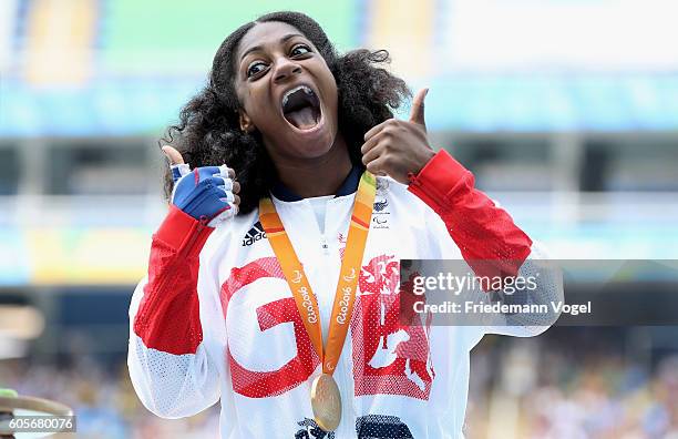 Gold medalist Kadeena Cox of Great Britain celebrates on the podium at the medal ceremony for the Women's 400m - T38 on day 7 of the Rio 2016...