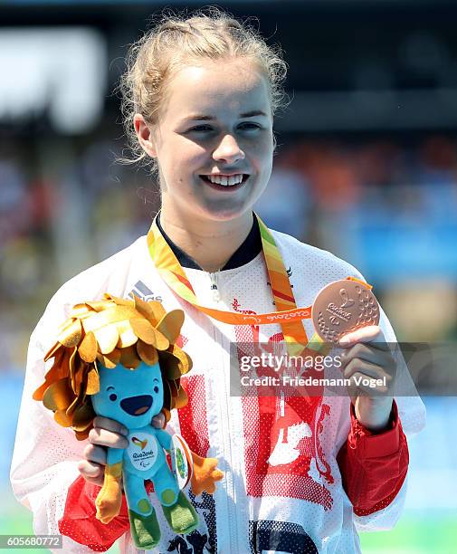 Bronze medalist Maria Lyle of Great Britain poses on the podium at the medal ceremony for the Women's 100m - T35 on day 7 of the Rio 2016 Paralympic...