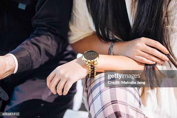 Mitchell Oakley Smith and Amy Yasmine wear Michael Kors Access Smart Watches at Spring Studios on September 14, 2016 in New York City.