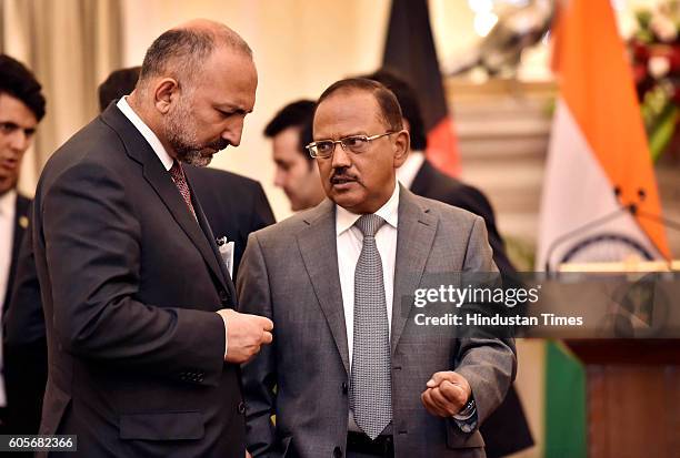 Afghanistan National Security Advisor Mohammad Hanif Atmar and Indian counterpart Ajit Doval prior to the agreement signing ceremony, following...