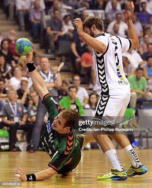 Kresimir Kozina of Fuechse Berlin and Helge Freiman of GWD Minden during the game between Fuechse Berlin and the GWD Minden on september 14, 2016 in...