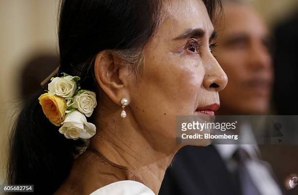 Aung San Suu Kyi, Myanmar state counselor, listens as U.S. President Barack Obama, right, speaks in the Oval Office of the White House following a...