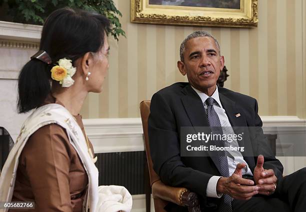 President Barack Obama, speaks as Aung San Suu Kyi, Myanmar state counselor, left, listens in the Oval Office of the White House following a...