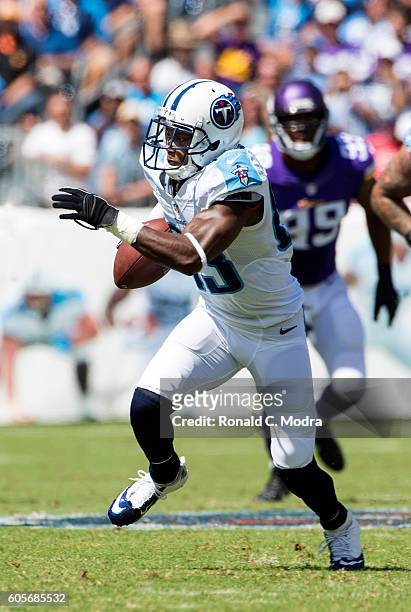 Wide receiver Harry Douglas of the Tennessee Titans carries the ball during a NFL game against the Minnesota Vikings at Nissan Stadium on September...