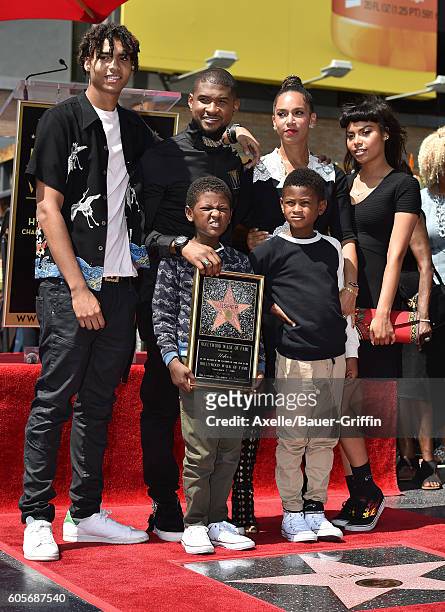 Recording artist Usher, sons Usher Raymond V and Naviyd Ely Raymond, and wife Grace Miguel attend the ceremony honoring Usher with a star on the...
