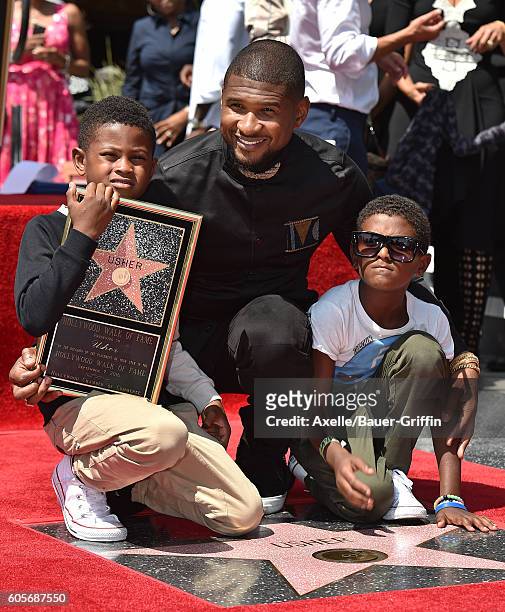 Recording artist Usher and sons Usher Raymond V and Naviyd Ely Raymond attend the ceremony honoring Usher with a star on the Hollywood Walk of Fame...