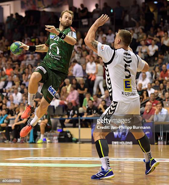 Steffen Faeth of Fuechse Berlin and Miladin Kozlina of GWD Minden during the game between Fuechse Berlin and the GWD Minden on september 14, 2016 in...