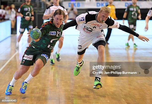 Mattias Zachrisson of Fuechse Berlin and Christoffer Rambo of GWD Minden during the game between Fuechse Berlin and the GWD Minden on september 14,...