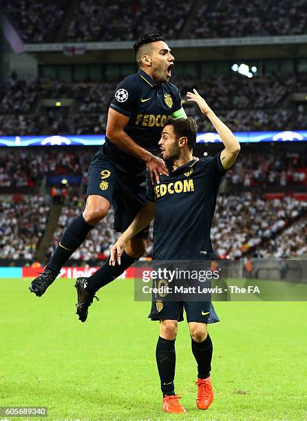 Radamel Falcao Garcia celebrates with Bernardo Silva of AS Monaco after he scored the opener during the UEFA Champions League match between Tottenham...