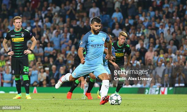 Sergio Aguero of Manchester City scores from the spot during the UEFA Champions League match between Manchester City FC and VfL Borussia...
